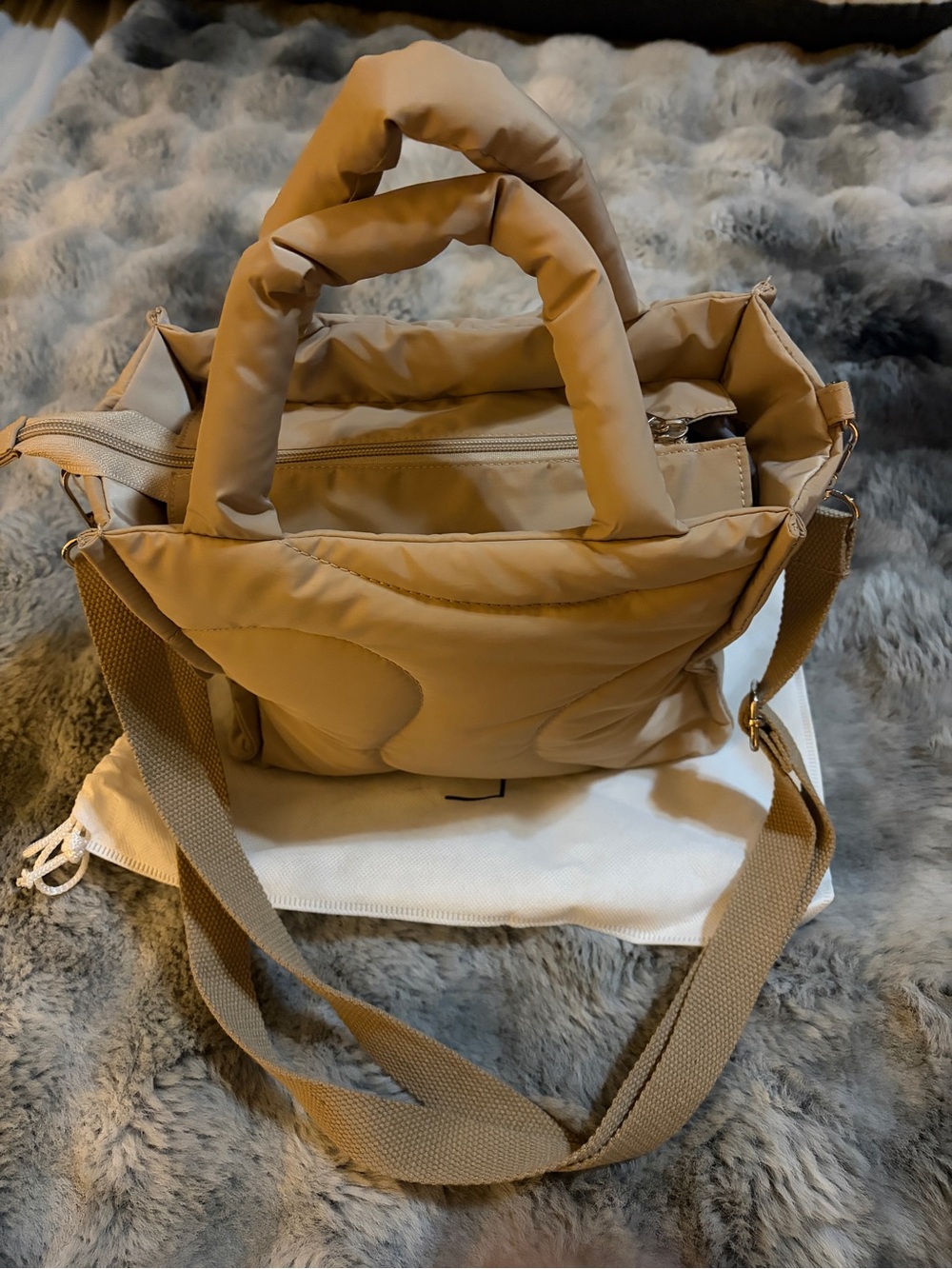 Quilted Puffer Crossbody Tote in Tan looks like lululemon style.